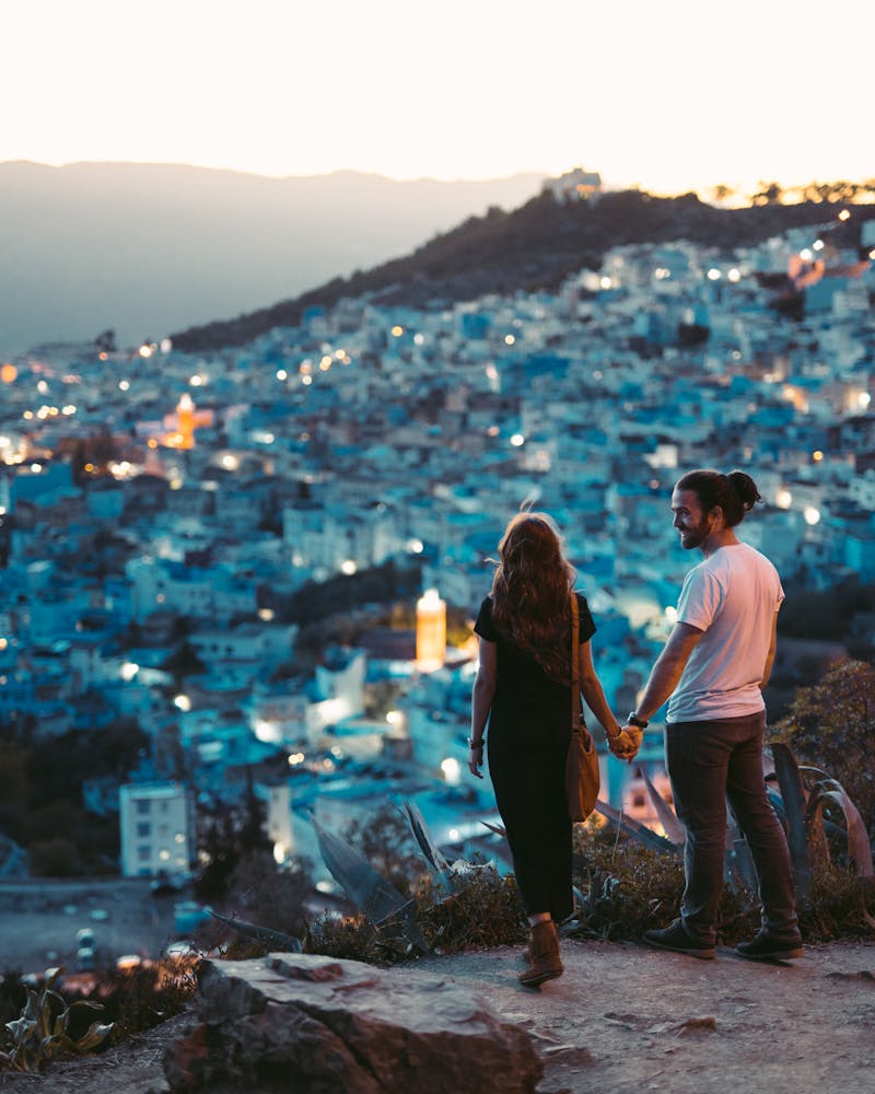 Couple overlooking the ocean at sunset